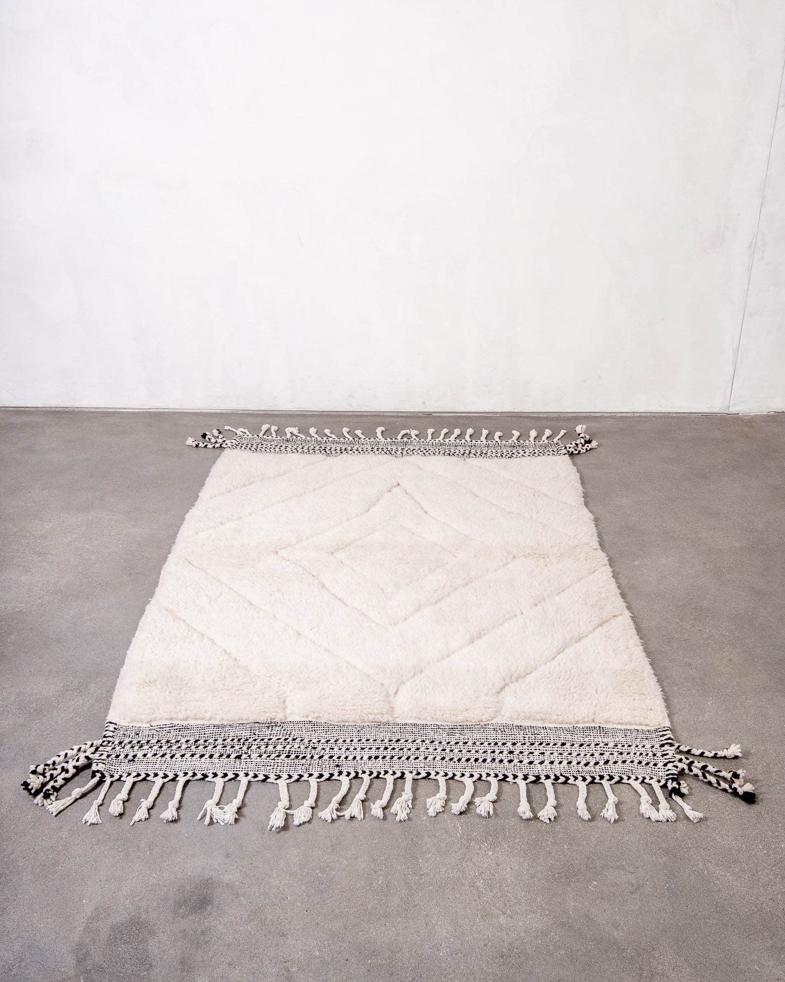 Modern, designer, handcrafted Berber rug from Morocco. Beniourain carpet with beautiful colours and patterns and fluffy wool texture.